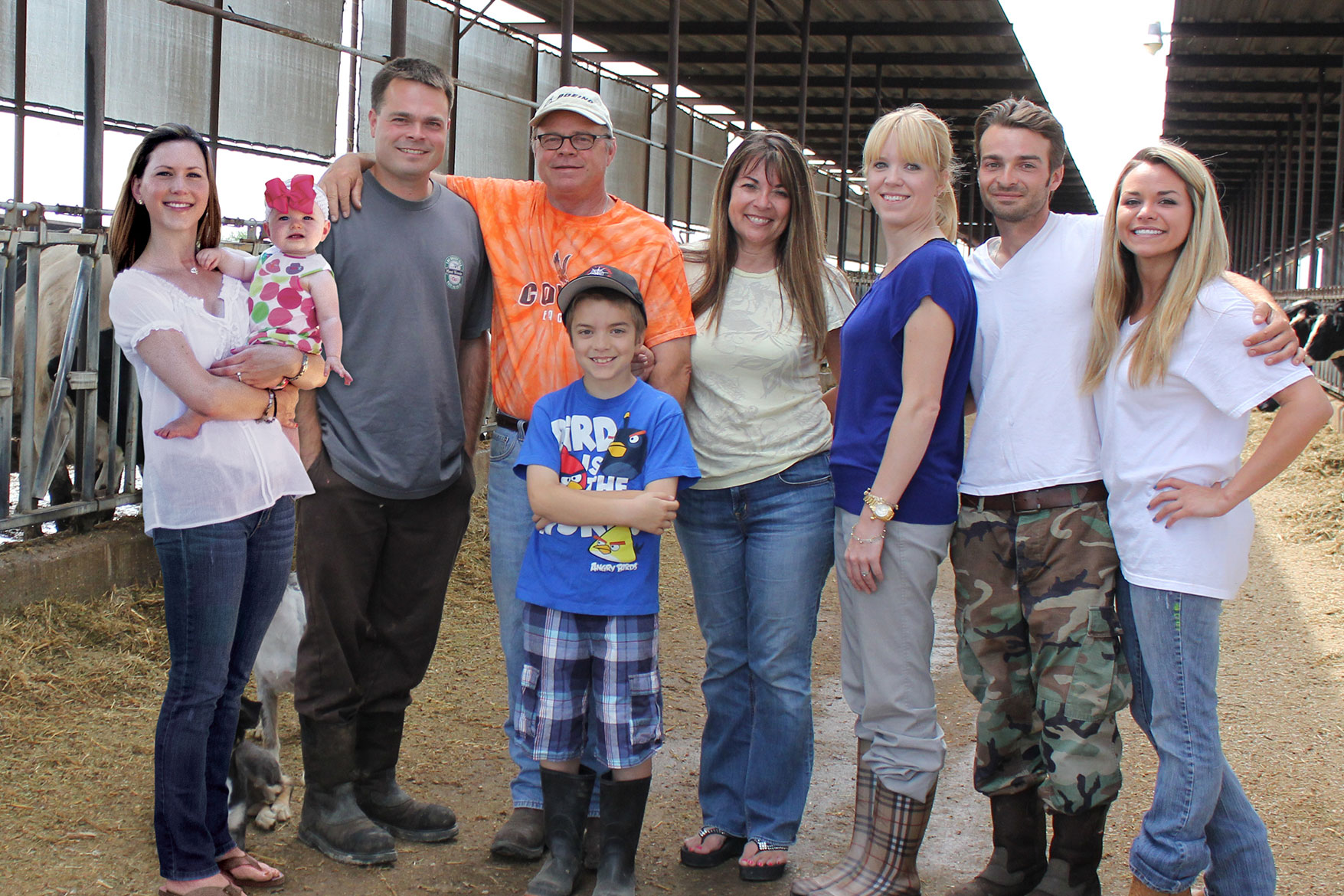 The Strona family poses for a picture in their barn.