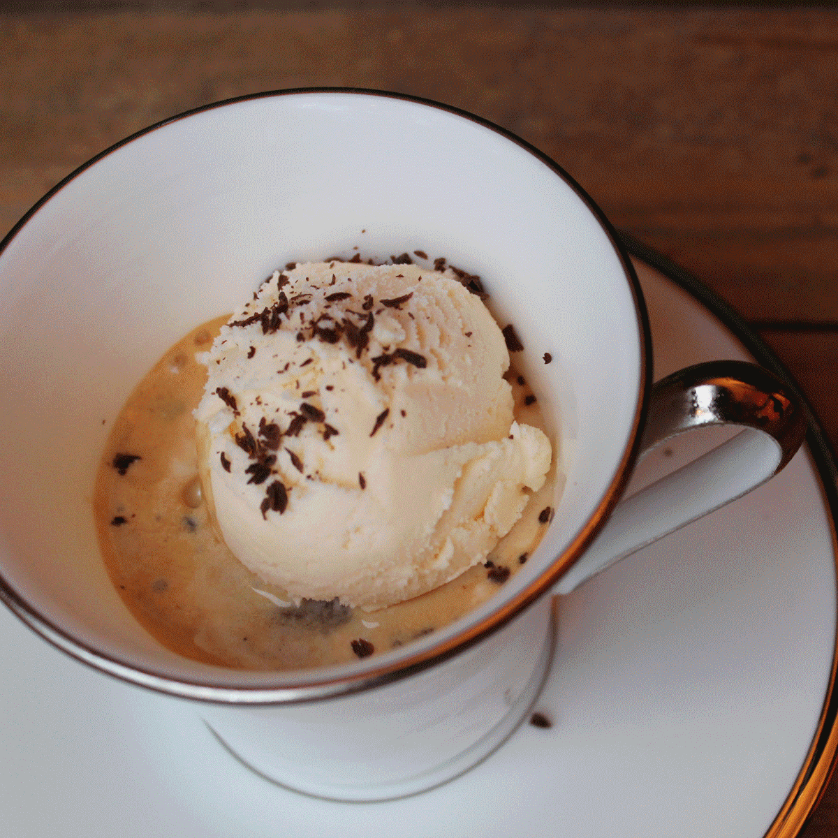 ice cream topped with espresso and shaved chocolate