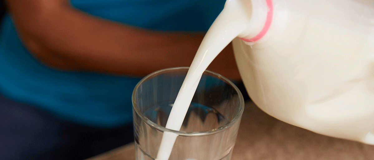 milk pouring into a glass